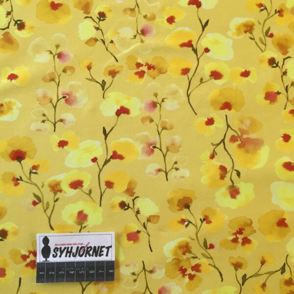 Bomuldsjersey gul med gule og orange blomster økotex 100