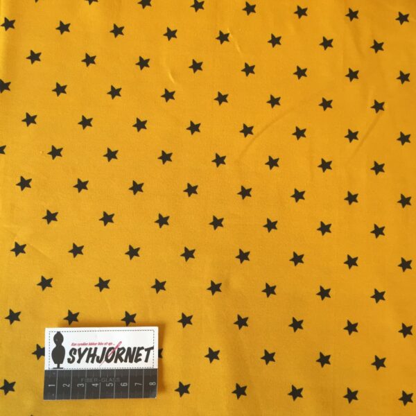 Bomuldsjersey gul med sorte stjerner økotex 100